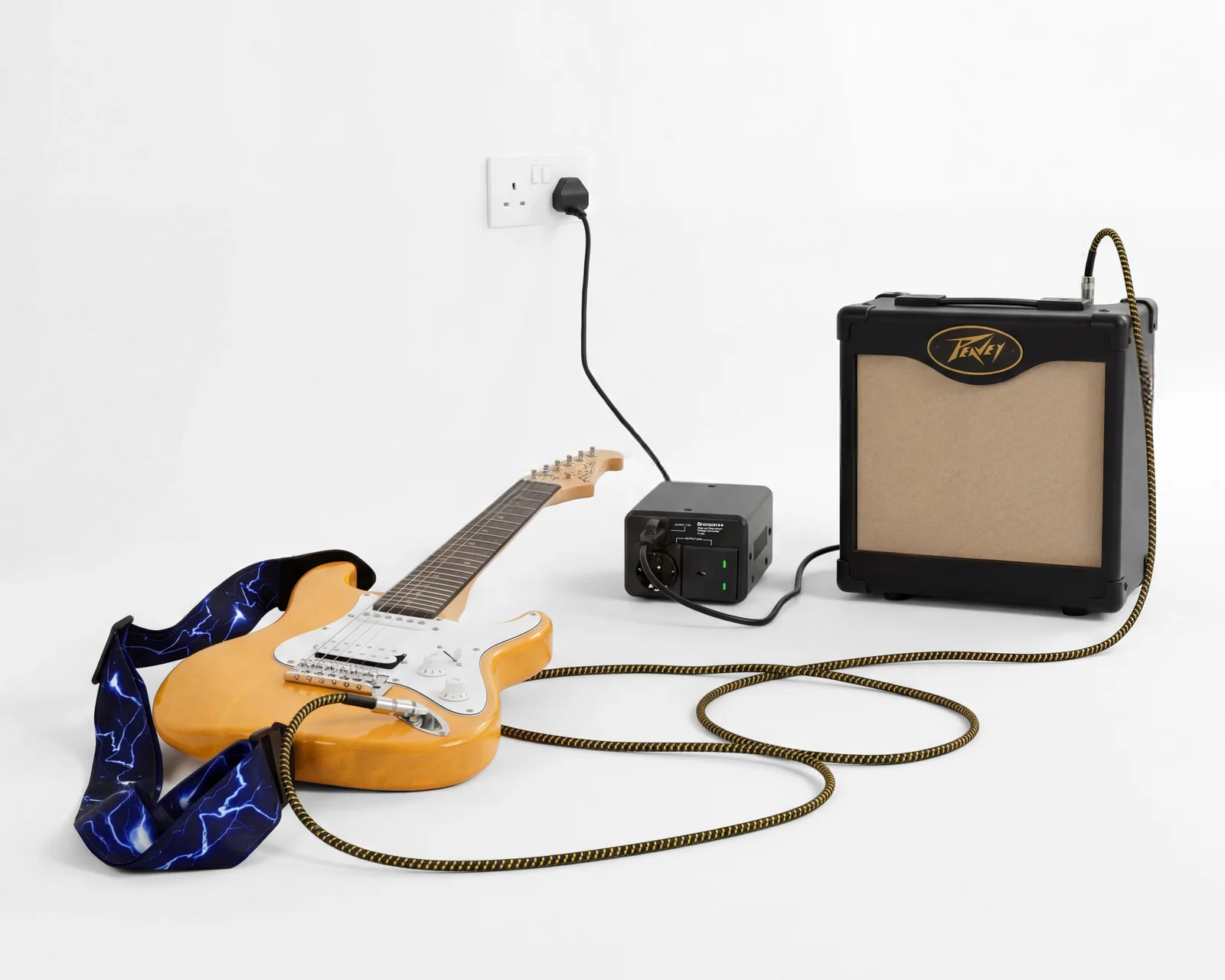 Bronson TI-300 powering a Peavey guitar amplifier via UK plug adapter